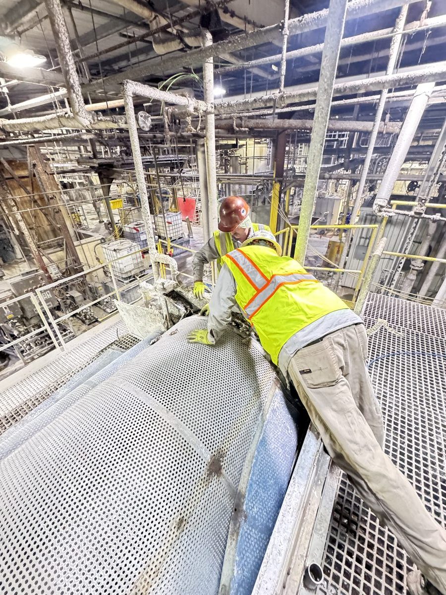 Crew working on industrial equipment