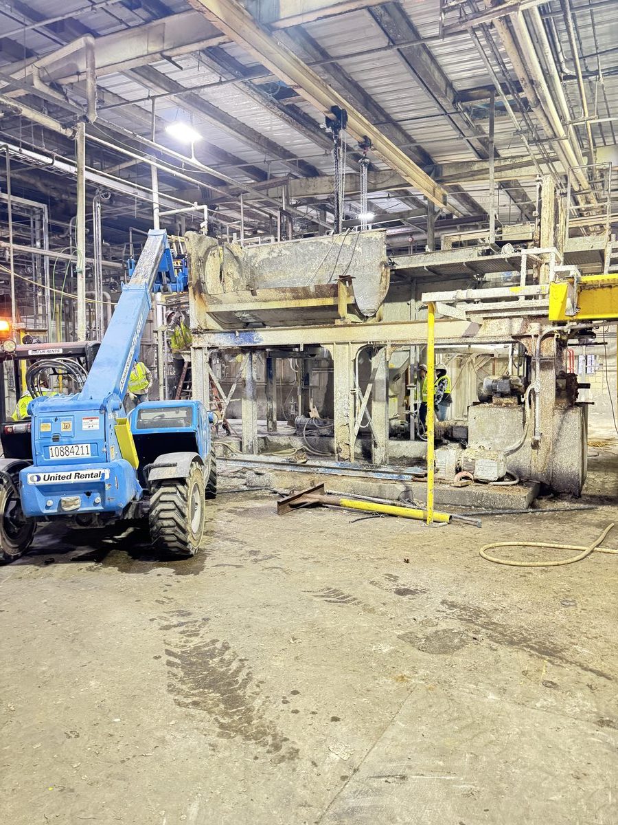 Heavy equipment rigging inside industrial facility